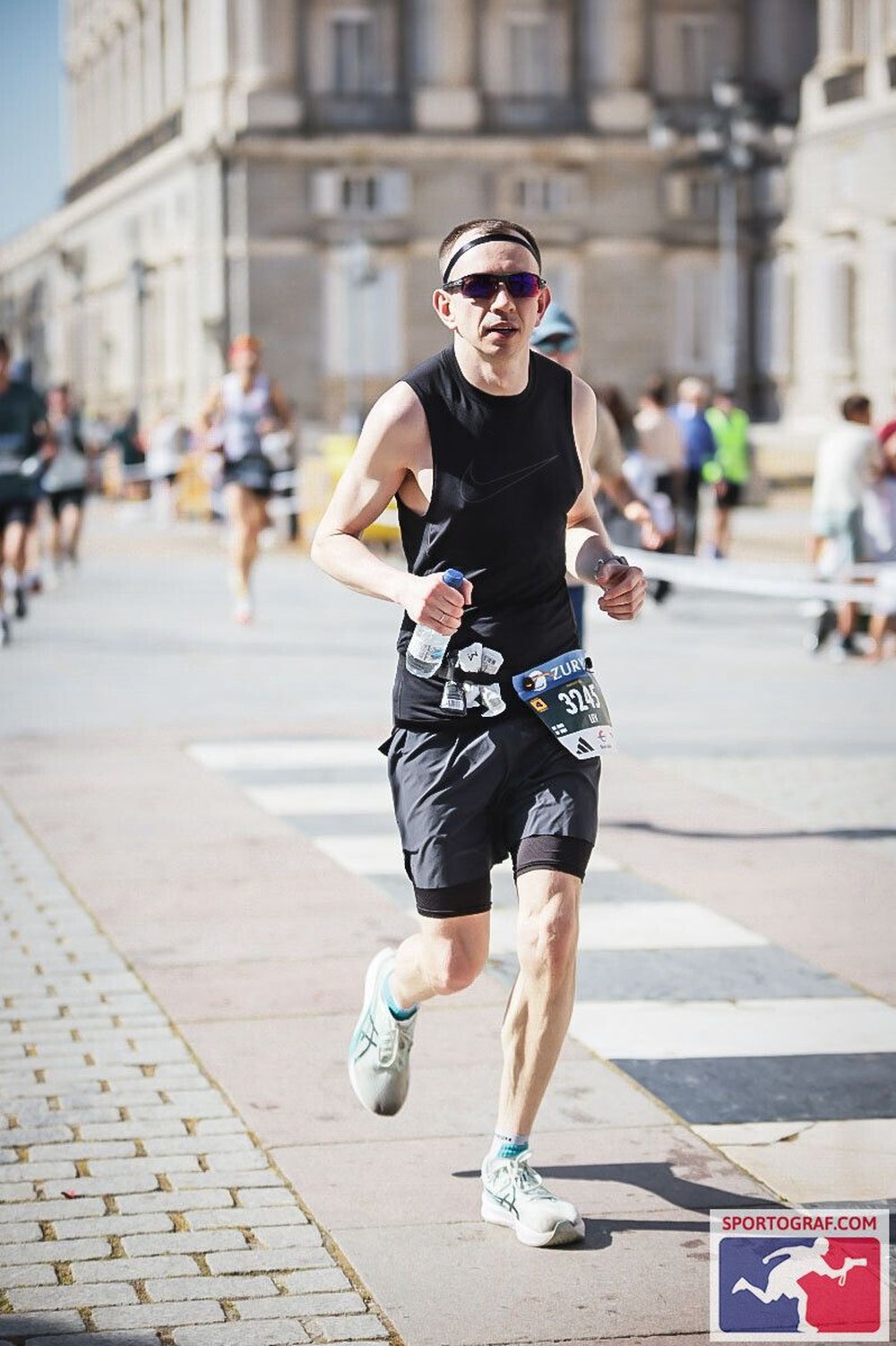 Mid-race at the Madrid Marathon, running past the Royal Palace.