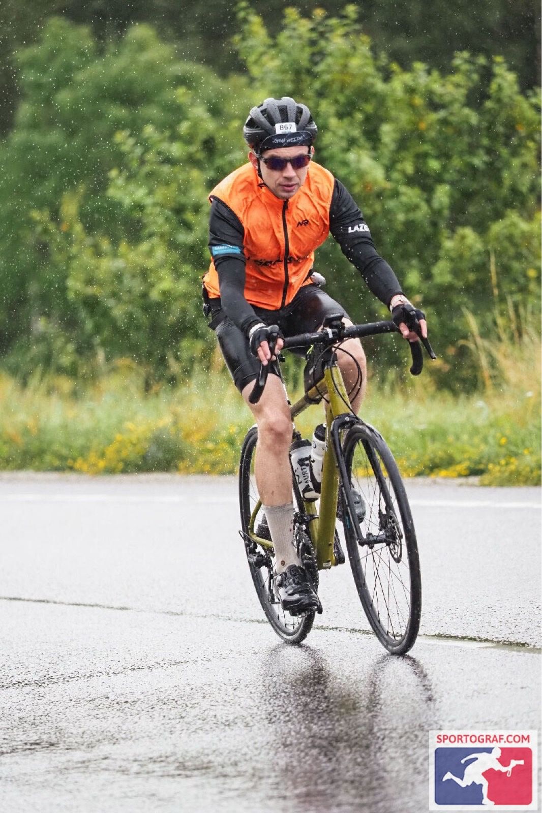Riding a road bike in the rain on wet roads.