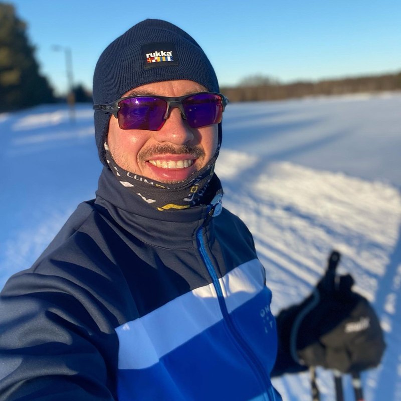 Cross-country skiing on a sunny winter day in Finland.